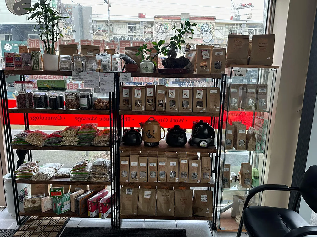 Bao An Tang herbal dispensary interior — product shelving and brewing pots at 401 Victoria Street
